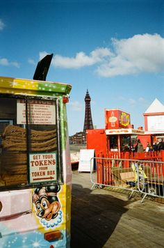 an ice cream truck parked in front of the eiffel tower