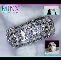 an image of a ring with diamonds on it