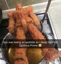 a metal bowl filled with fried food on top of a stove