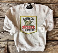 Youth sizes! As a famers wife I can't agree more with this 👆 America Needs Farmers. . Unisex fit  True to size fit 8 oz Sweatshirt  Ash color 50/50 poly cotton blend We use port & company and Ecosmart pullovers . 1-3 week turnover This is our original design. We do not sell our designs.  . Care instructions- wash cold with like colors. Delicate dry on low heat.  . Processing time is 1-3 weeks This image is an original design by our shop. We do have a copyright on this image. DO NOT COPY! Gifts For Farmers, Daughter Gifts, Western Outfits, Perfect Shirt, Cute Shirts, Agriculture, Original Design, Cool Shirts, Farmer