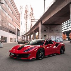 a red sports car parked on the street