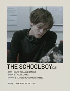 a young man wearing headphones sitting in front of a white poster with the words the schoolboy 2013 written on it