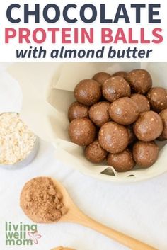 chocolate protein balls with almond butter in a white bowl and on a wooden spoon next to it