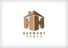 the logo for harmony homes, which has been designed to look like an old house