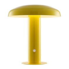 a yellow table lamp sitting on top of a white floor