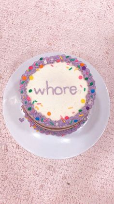 a birthday cake with the words who's on it sitting on a white plate