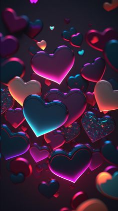 many hearts are floating in the air on a black background with pink and blue lights