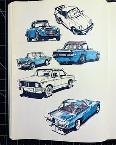 an open book with drawings of different cars on it's cover, including one blue car and the other white car