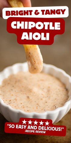 the cover of bright and tangy chipotle aioli is being held by a hand