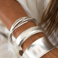 A frosty, hand hammered Hilltribe Silver bangle with five individual inter-twined bangles. A design representing the echo of past adventures. Compliments beautifully with our Rockpools Necklace, the hand hammered style allows for movement and a slight shimmer. MaterialsHammered Hilltribe Silver Various sizes available Each piece is individually handmade. Therefore, pieces may slightly differ in shape from the images shown Medieval Character, Toe Ring Designs, Silversmithing Jewelry, Sterling Silver Toe Rings, Hammered Bangles, Silver Toe Rings, Oc Ideas, Stacked Jewelry, Silver Bangle