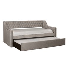 a gray couch with a pull out bed underneath it and a white sheet on the bottom