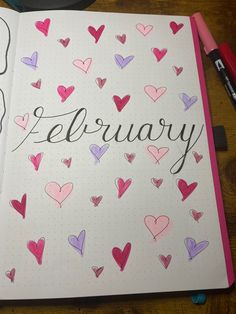 an open notebook with hearts and the word february written in cursive writing