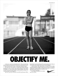 a woman standing on top of a running track with her arms crossed in front of her chest