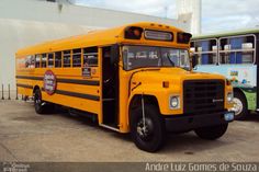 two yellow school buses parked next to each other