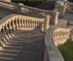 the stairs are made of stone and have balconies on each side with railings