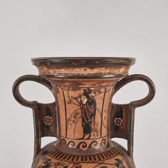 an old vase with decorative designs on it