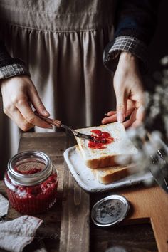 a person cutting up food on top of a white plate