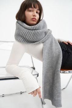 Make your style A LOT cozier with our extra-long Bronx Scarf. Bronx is both knit from ultra-soft French Merino Wool mix to warm your soul and fashioned extra long to make a statement. Wrap this Merino wool scarf around and around for volume, or wear her draped over your shoulders to lend your look texture and drama. This soft wool scarf also doubles perfectly as an airplane blanket. | Natalee, in medium grey, is 5'10" (178 cm) tall. Astrid, in medium grey, is 5'9" (175 cm) tall. Steph Long Knit Scarf, Scarf Wrap Styles, Burnt Yellow, Airplane Blanket, Money Stacks, Merino Wool Scarf, Crochet Wool, Retro Clothing, Long Knit