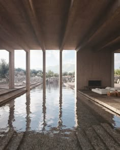 an indoor swimming pool in the middle of a building with large windows on each side