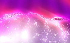 an abstract photo with water and pink light