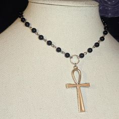 Large Ankh Cross Pendant Choker Necklace. Made With Black Glass Beads & Finished With Chain In The Back. Measures Approximately 14 Inches. Has A Lobster Clasp And 1.5 Inch Extension Chain. #Rosary #Choker #Cross #Goth #Grunge Black Ankh Jewelry For Gifts, Handmade Metal Ankh Necklace, Spiritual Silver Onyx Beaded Necklaces, Black Ankh Spiritual Jewelry, Silver Cross Jewelry With Black Beads, Black Ankh Necklace In Metal, Adjustable Ankh Black Necklace, Ankh Shaped Black Metal Necklace, Black Ankh Metal Jewelry