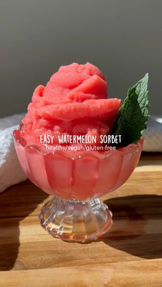 watermelon sorbet in a glass bowl on a wooden table