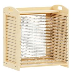 a wooden cabinet with wire baskets on the top and bottom shelf for storing small items