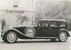 an old black and white photo of a car