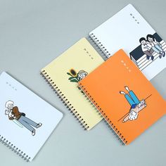 three notebooks with cartoon characters on them