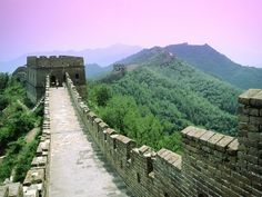 the great wall of china with mountains in the background