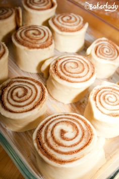 cinnamon rolls on a baking tray ready to be baked