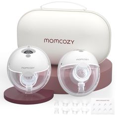 the momcozy baby monitor is set up in front of it's case