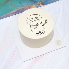 a white cake with a cartoon character on it