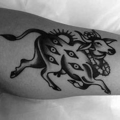 a black and white photo of a tattoo on the arm