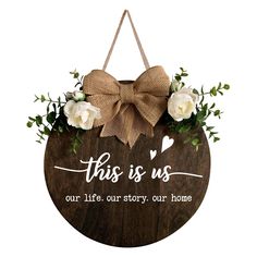 this is us our life story our home sign with white roses and burlock