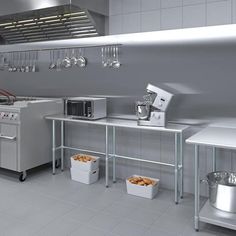 an industrial style kitchen with stainless steel appliances