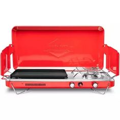 a red portable stove with two burners on the top and one side open to show it's cooking surface