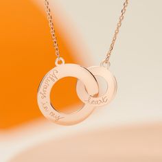 Symbolizing an ever-lasting bond, our Personalized Intertwined Necklace can be hand-engraved with your own special words for the perfect gift.The two circles move freely between each other and as a result, this is one of the few products where we engrave on one side only.18K Champagne Gold Plated, 925 Sterling Silver or 18K Rose Gold Plated18 Gold Plated chainLarge Circle (0.8 wide), small circle (0.5 wide)Hand engraved in our Paris workshopSent with love in a complimentary gift boxAny slight va Intertwined Necklace, French Cursive, Oranges Gift, Handwriting Styles, Personalised Jewellery, Christmas Gifts For Wife, Small Circle, Metal Engraving, Jewellery Gift