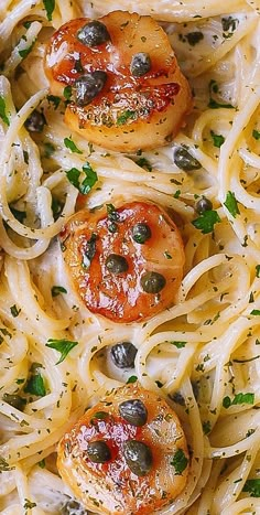 pasta with shrimp and olives in a white sauce