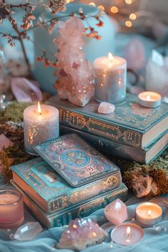 candles, books and crystals on a table