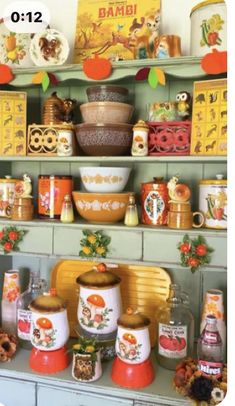 the shelves are filled with colorful dishes and knick - knacks on them