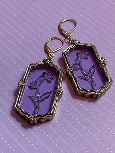 These timeless beauties are just perfect! The beautiful purple glass catches the light effortlessly highlighting the carefully crafted etched roses.  For some reason I'm reminded of beauty and the beast when I look at them, just a timeless classic simple beauty. Matching Pendant on light gold plated gorgeous 18" filigree box chain now available in drop down menu! Purple Brass Drop Earrings, Purple Brass Jewelry With Matching Earrings, Vintage Rose Gold Tarnish Resistant Jewelry, Purple Brass Earrings As Gift, Vintage Jewelry With Lever Back, Vintage Lever Back Drop Earrings, Vintage Lavender Jewelry, Vintage Lever Back Earrings As Gift, Brass Jewelry With Lever Back For Gift