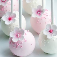 pink and white cake pops with flowers on them stock photo - image 349874