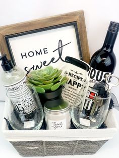 a basket filled with wine bottles next to a sign that reads, home sweet recipe