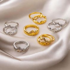 This 2pcs set of trendy tiny zircon mountain rings is the perfect addition to any jewelry collection. Made from high-quality stainless steel, these geometric finger rings offer durability and long-lasting shine. The minimalist mountain design adorned with sparkling zircon stones makes these rings both elegant and stylish, ideal for women who love modern accessories. Whether for a party, wedding, or casual wear, these rings bring a touch of sophistication and trendiness. They also make a thoughtful gift for birthdays, anniversaries, or special occasions. Set of two rings Made from durable stainless steel Tiny zircon stones for added sparkle Geometric mountain design Perfect for weddings, parties, or everyday wear A great gift for her Mountain Rings, Rings Trendy, Minimalist Mountain, Mountain Ring, Trendy Rings, Geometric Mountain, Mountain Design, Modern Accessories, Mountain Designs