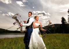 a bride and groom posing for a photo in front of a lake with their instruments