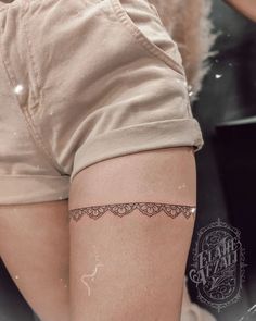 a woman's leg with a tattoo on it