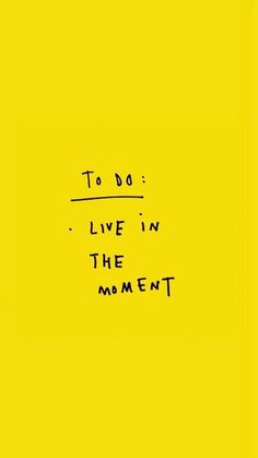 the words to do live in the moment are written on a yellow paper with black ink