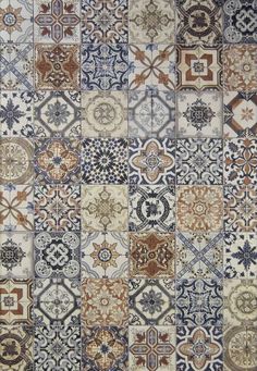 an area rug with many different colored and patterned designs on it's sides, including blue