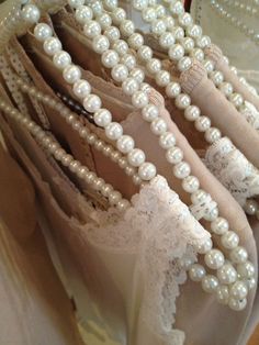 there are many pearls and laces on display